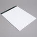 A white TOPS writing pad with lined paper.