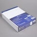 A stack of Ampad wide ruled writing pads.