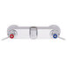 A silver Fisher wall mounted faucet base with swivel outlets and lever handles.