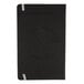 A black rectangular TOPS journal with a circular design on the front.