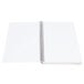 A white spiral bound notebook with narrow ruled paper.