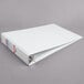 A white Cardinal tabloid size binder with 2" slant D rings.