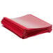 A stack of red Oxford clear front report covers with 3-prong fasteners.