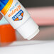 An Elmer's all-purpose glue stick on a table.