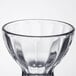 A clear glass bowl with a curved edge.