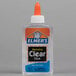 An Elmer's clear liquid glue bottle on a table.