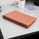 A stack of brown Pendaflex letter size file pockets.