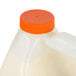 A plastic jug of Elmer's Carpenter's Interior Wood Glue with a handle and orange cap.