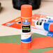 An Elmer's clear glue stick on a table.