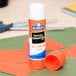 An Elmer's clear glue stick on a table.