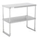 A Regency stainless steel double deck overshelf on a stainless steel table.