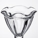 A clear Libbey tulip sundae glass with a wavy edge.