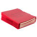 A stack of red Pendaflex personnel fastener folders.