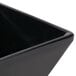 An American Metalcraft black square melamine sauce cup with a lid.