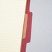 A close-up of a Pendaflex letter size classification folder with red and yellow paper inside.