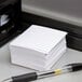 A pen on a stack of Oxford white ruled mini index cards.