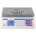 A Cardinal Detecto digital counting scale with screws on it.