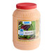 A plastic gallon container of AAK Russian dressing with a label.