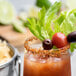Twang-a-Rita Sunrise Spice Chili-Lime Rimming Salt on the rim of a chili-lime drink garnished with a lime.