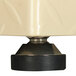 A close-up of a black and silver base with a black rubber base.