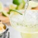 Twang-a-Rita lime rimming salt being poured onto a margarita.