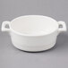 A white Bon Chef oval bowl with handles.