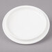 A white Bon Chef porcelain cocotte lid on a gray surface.