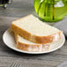 A sliced bread on a white Bon Chef porcelain plate.