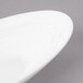 A white Bon Chef slanted oval porcelain bowl.