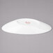 A white porcelain slanted oval bowl with red text on it.