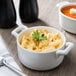 A white Bon Chef porcelain bowl filled with macaroni and cheese.