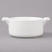 A white porcelain Bon Chef cocotte with handles.