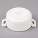 A white porcelain Bon Chef cocotte with handles.