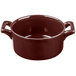 A brown Bon Chef porcelain cocotte with handles.