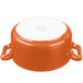 A white porcelain Bon Chef orange cocotte with a handle.
