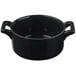 A black porcelain cocotte with handles.