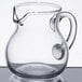 A clear glass Spiegelau Bodega pitcher with a handle.