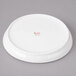 A white Bon Chef porcelain saucer.