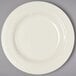 A white Homer Laughlin china bowl with a circular design on the border.