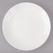 A white Bon Chef porcelain salad plate with a rim.