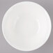 A white Bon Chef porcelain bowl with circles on a white background.