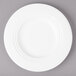 A white Bon Chef porcelain salad plate with a rim.