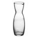 A clear glass carafe with a handle and spout.