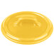 A yellow Bon Chef porcelain lid with a handle.