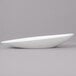 A close up of a white Bon Chef oval porcelain bowl.