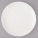 A white Bon Chef porcelain dinner plate with a white rim.