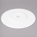 A white Bon Chef bone china plate with a wide rim.