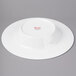 A white Bon Chef bone china plate with a wide round rim.