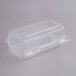 A Durable Packaging clear plastic container with a hinged lid.