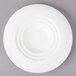 A white Bon Chef porcelain bowl with a circular pattern on the rim.